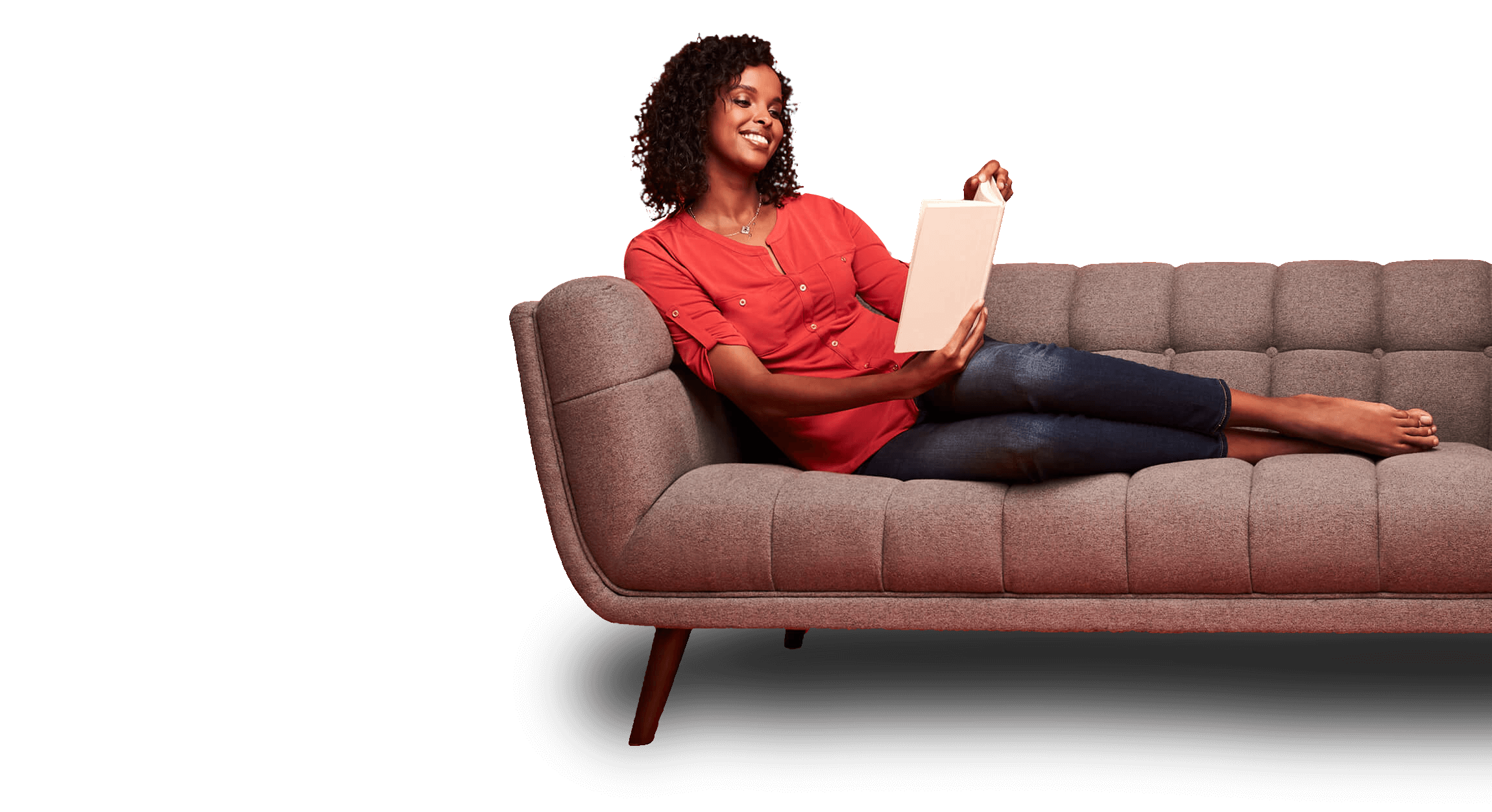 Woman sitting on a couch reading